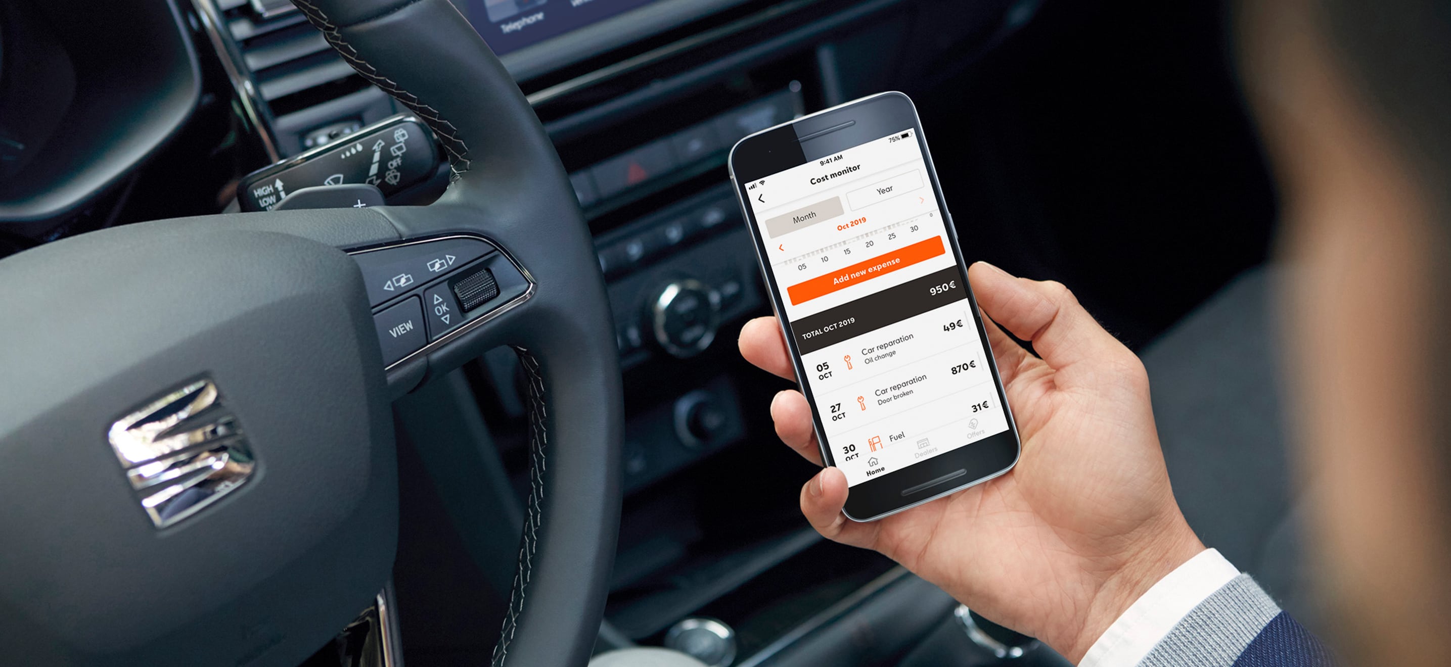 SEAT new car services and maintenance – My SEAT App in action in a car driver holding a phone
